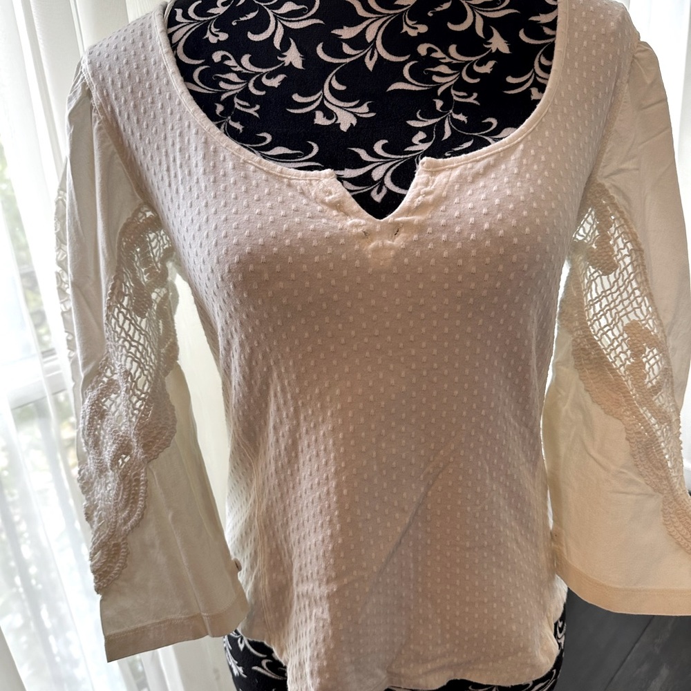 Cream ivory crochet sleeve top from Anthropologie.